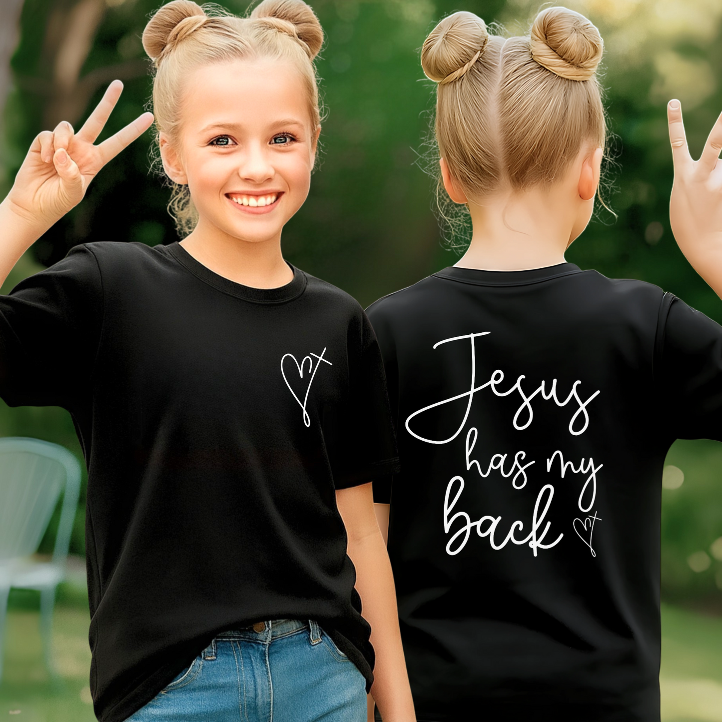 Two children wearing black t-shirts with 'Jesus has my back' text outdoors.