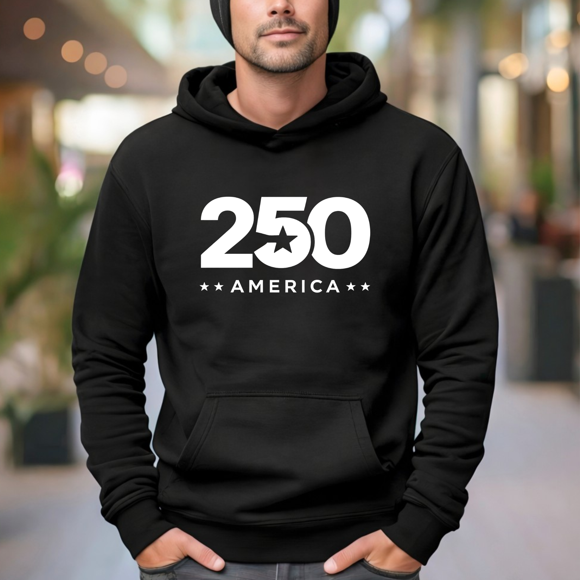 Person wearing a black hoodie with '250 America' text in an outdoor setting