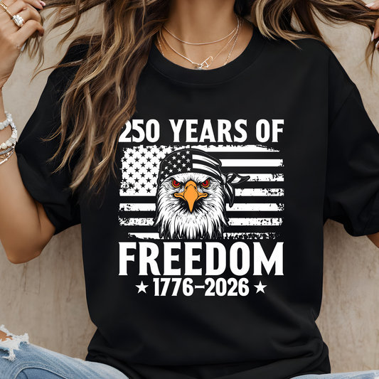 250 Years of Freedom eagle design on black women’s t-shirt hanging on wooden hanger