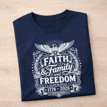 Navy blue t-shirt with Faith, Family and Freeom in white graphic design on a wooden surface