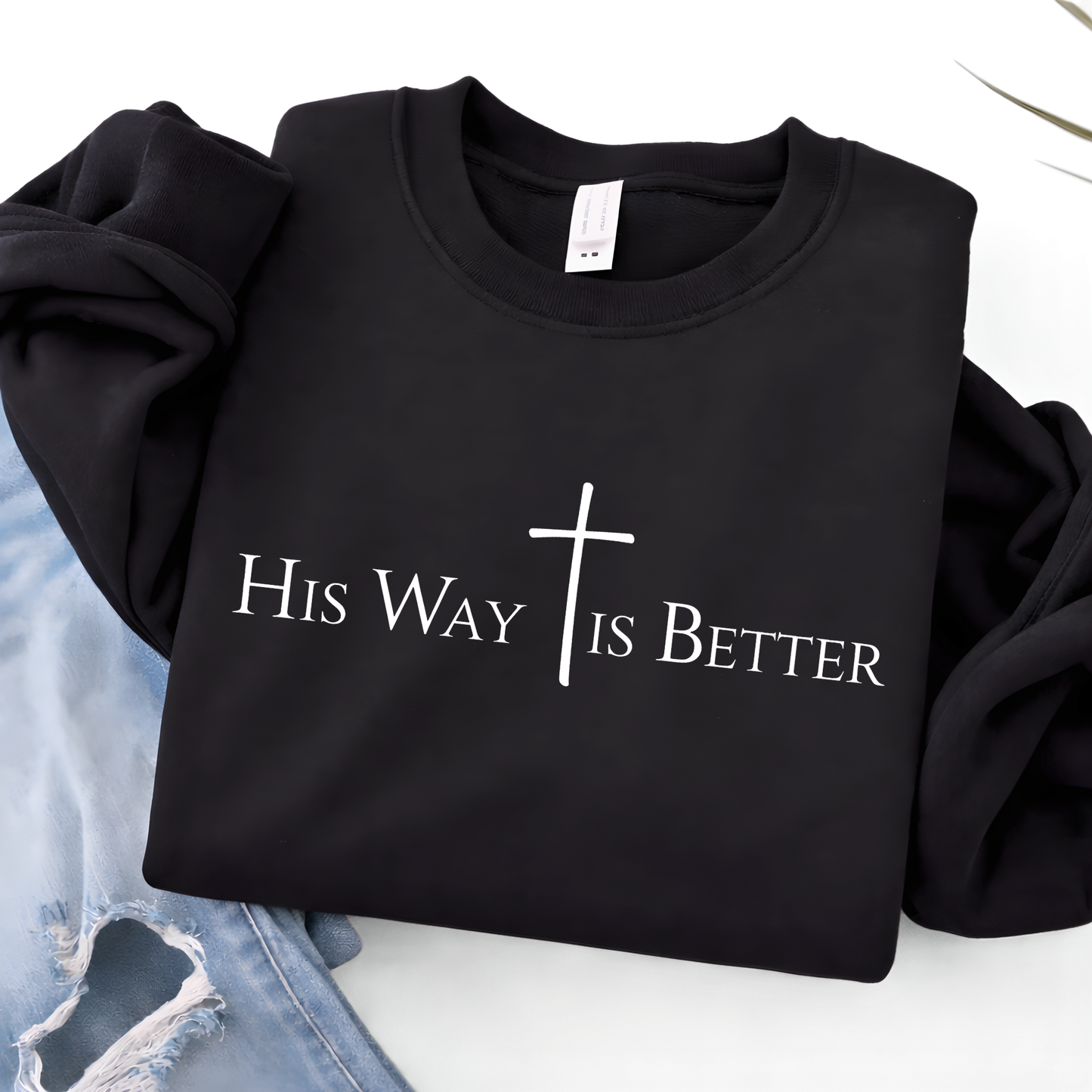 Black sweatshirt with 'His Way is Better' text and cross on a white background