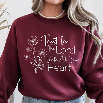 Maroon sweatshirt with 'Trust In The Lord With All Your Heart' text and floral designs.