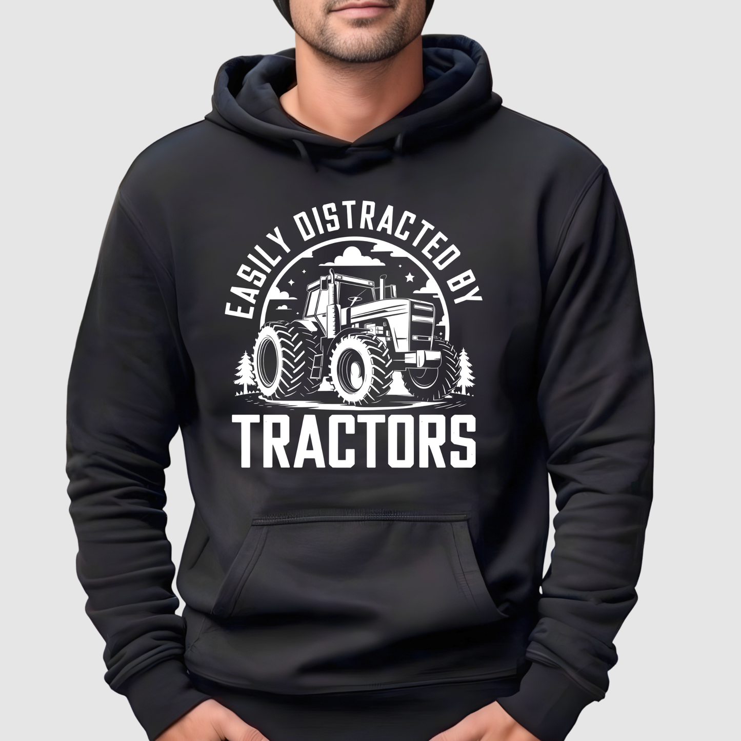 Black hoodie with tractor graphic and text on a gray background