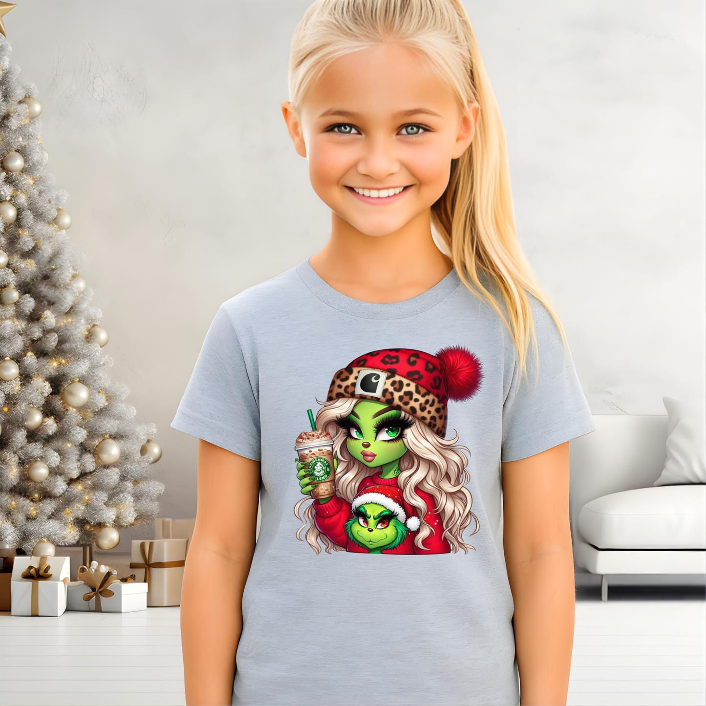 Young girl wearing a t-shirt with a graphic design in a festive room with a Christmas tree.