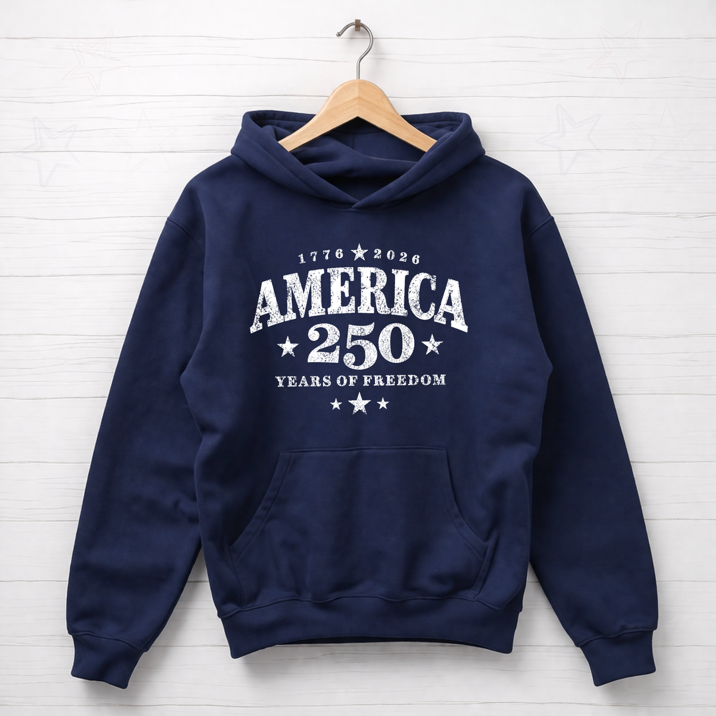Navy blue hoodie with 'America 250 Years of Freedom' text on a wooden hanger against a white background