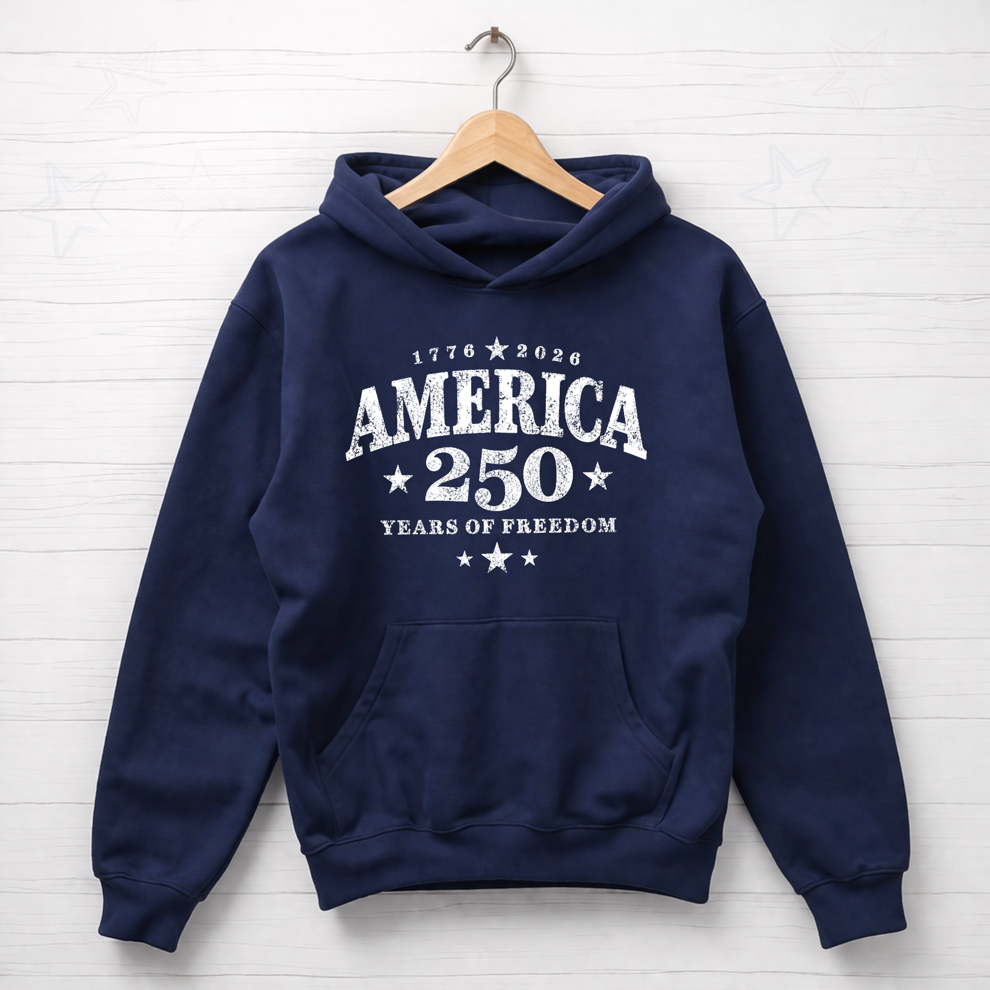 Navy blue hoodie with 'America 250 Years of Freedom' text on a wooden hanger against a white background