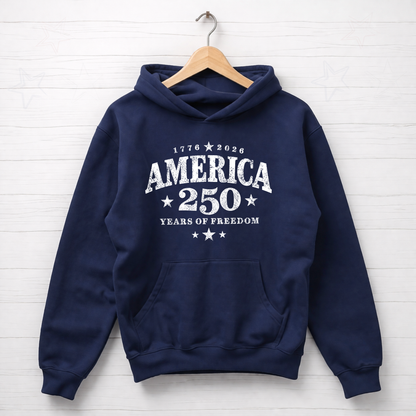Navy blue hoodie with 'America 250 Years of Freedom' text on a wooden hanger against a white background