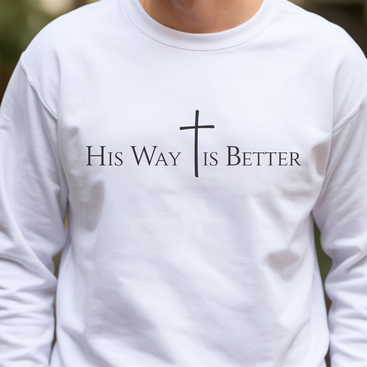 White long-sleeve shirt with 'His Way Is Better' text and cross design.