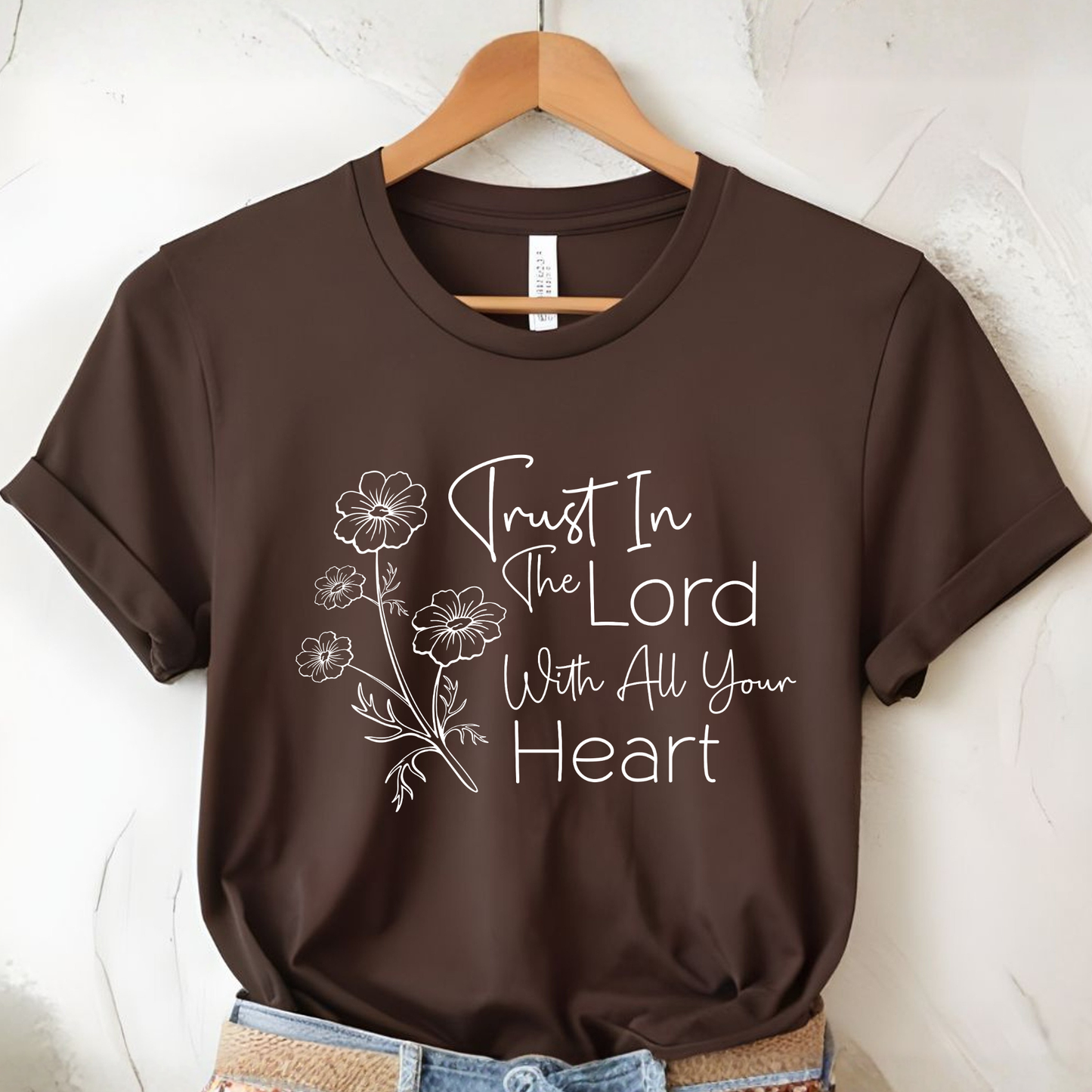 Brown unisex Christian t-shirt flat lay featuring trust in the Lord floral graphic