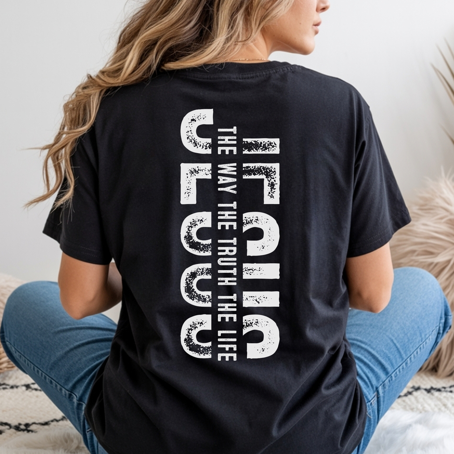 Back view of black Christian t-shirt featuring vertical “Jesus The Way The Truth The Life” faith design