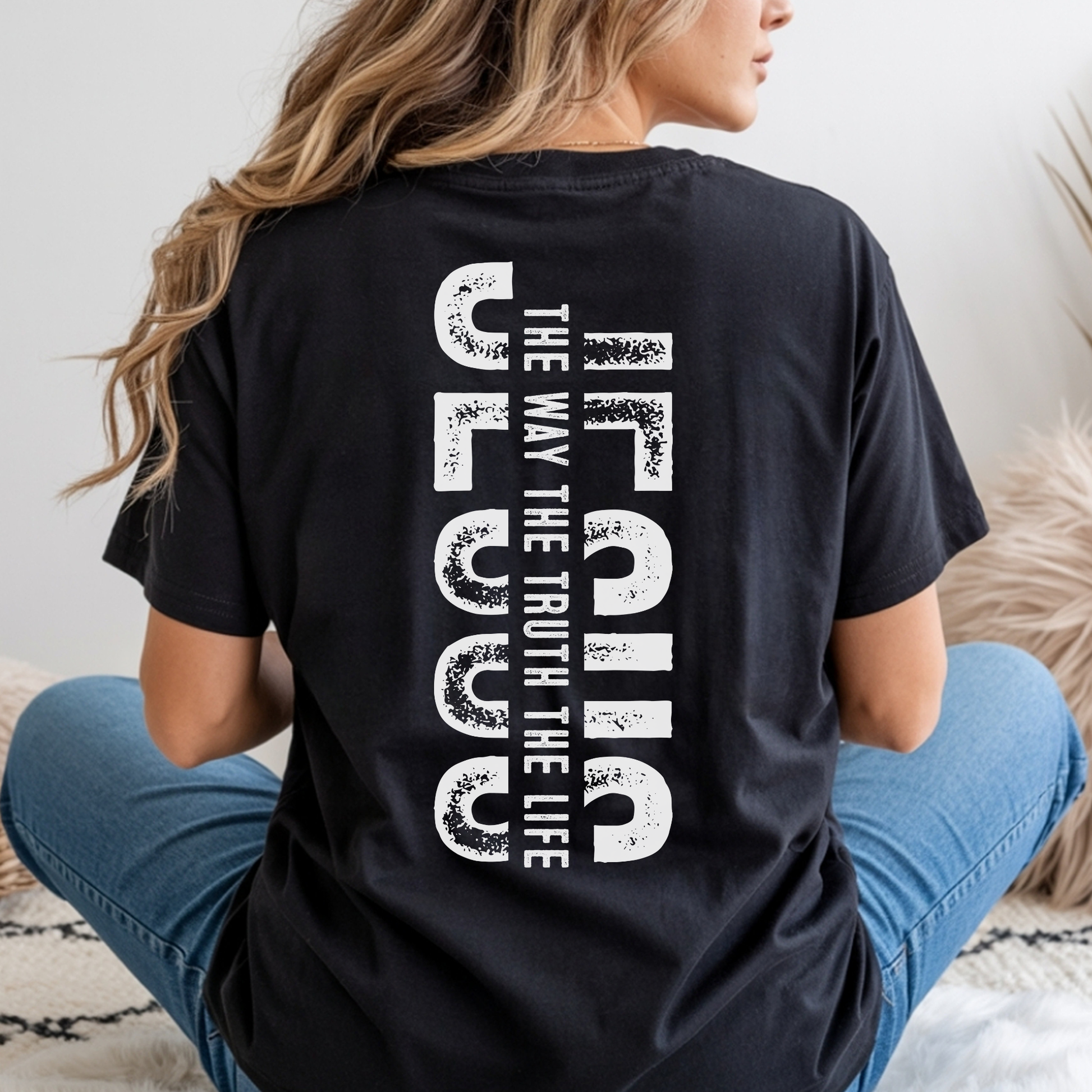 Back view of black Christian t-shirt featuring vertical “Jesus The Way The Truth The Life” faith design