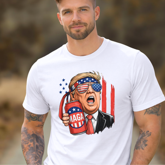 Man wearing a white t-shirt with a graphic design of a political figure holding a can with 'MAGA' on it, outdoors.