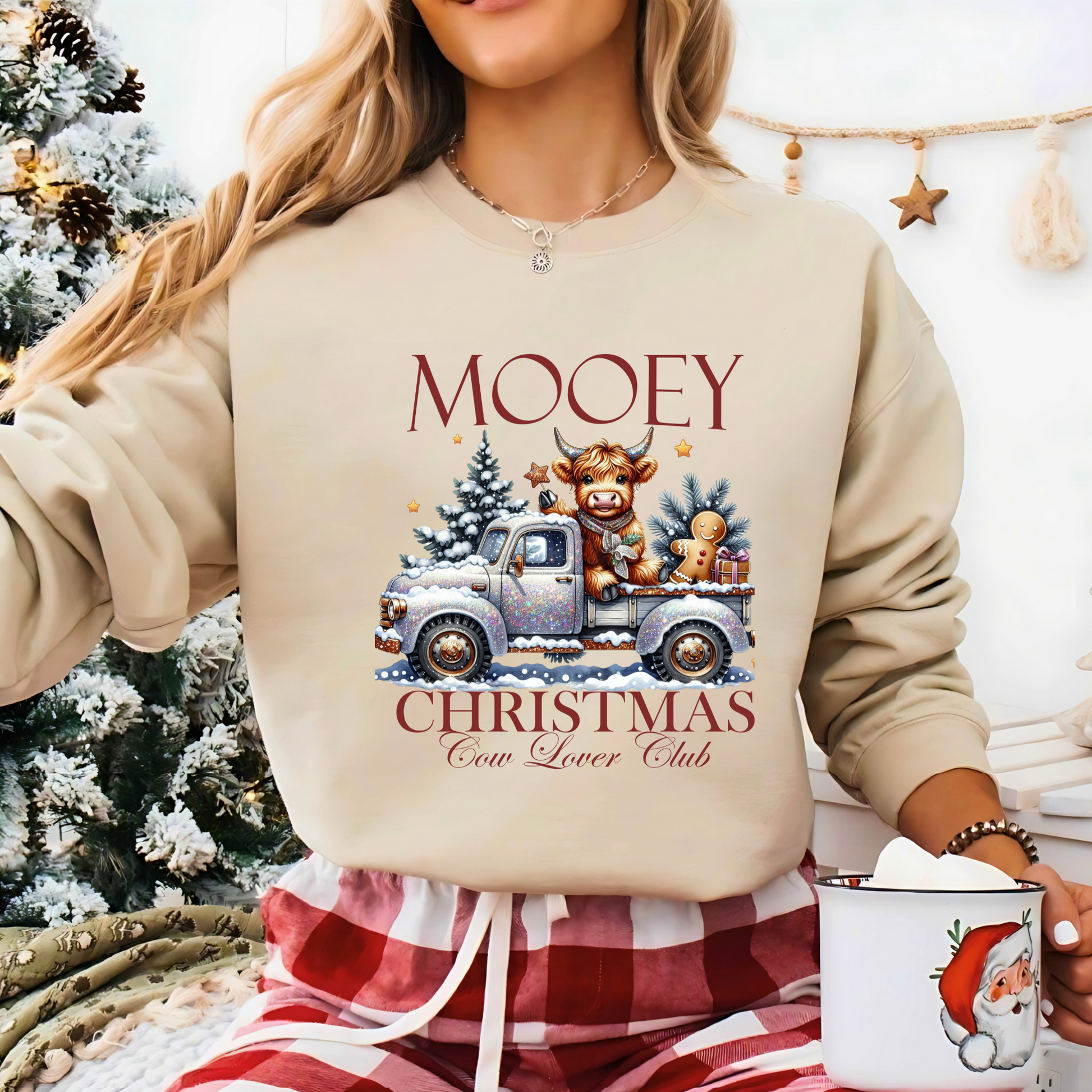 Light Sand sweatshirt with “Mooey Christmas Cow Lover Club” graphic
