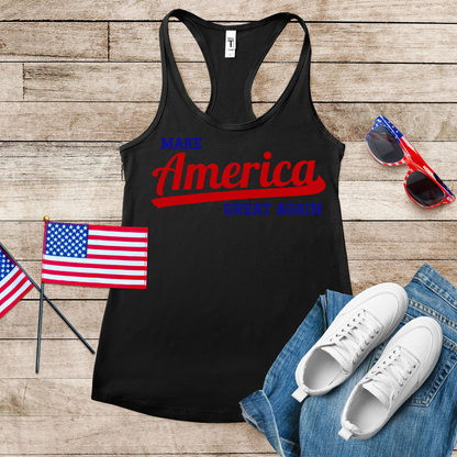 "Close-up flat lay of black MAGA tank top showing detailed vintage script design in red and blue with American Flag laying close