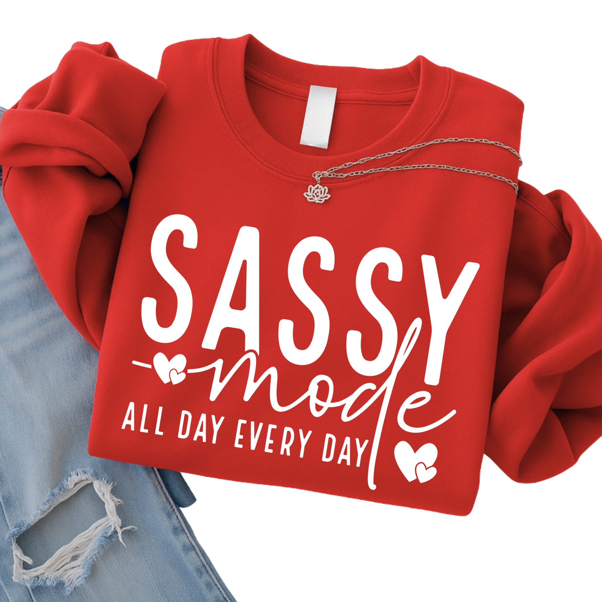 Red sweatshirt with 'Sassy mode all day every day' text on a white background