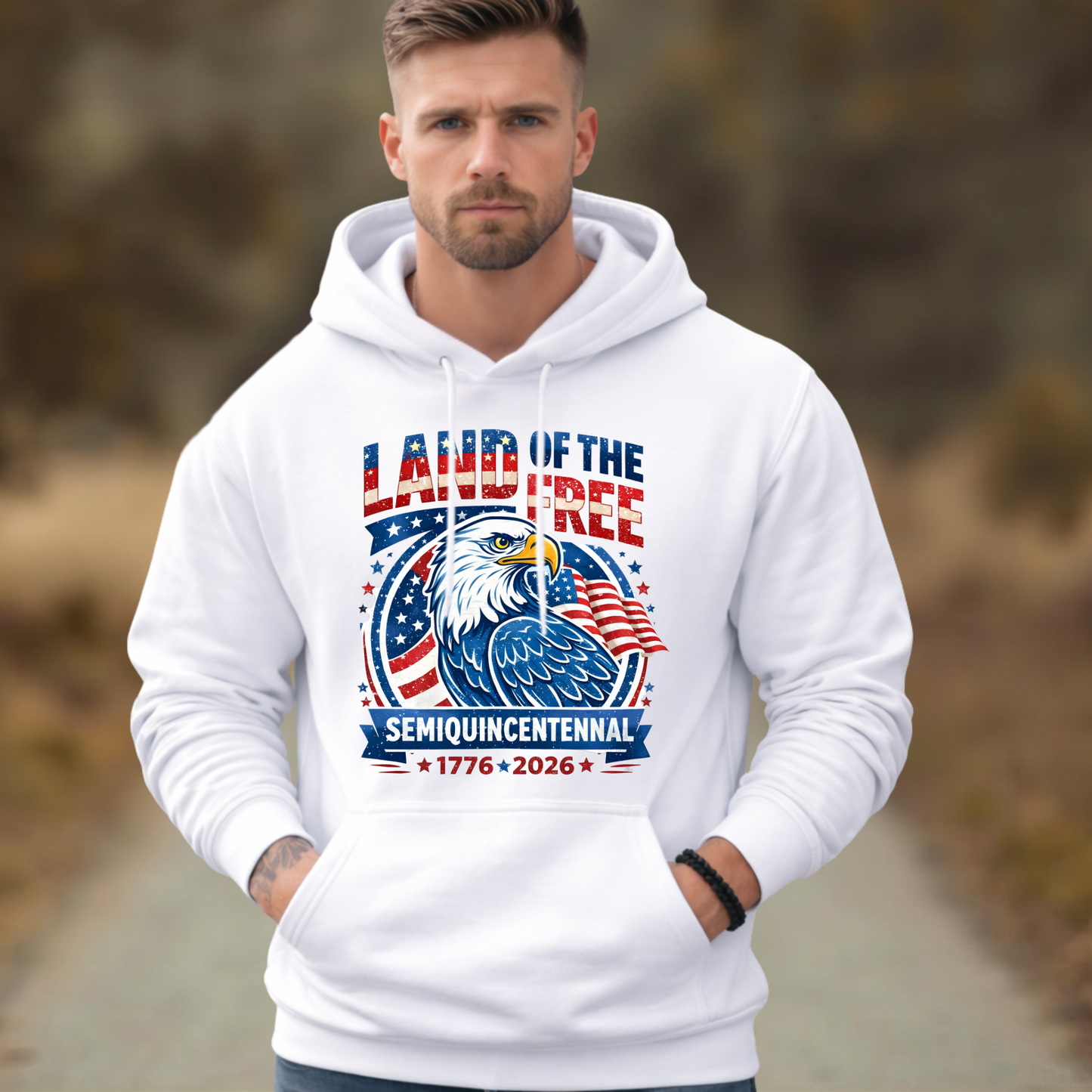 Man wearing a white hoodie with a Semiquincentennal patriotic design featuring an eagle and text.