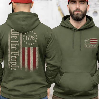 Green hoodie with 'We The People' design on the back, worn by a person.