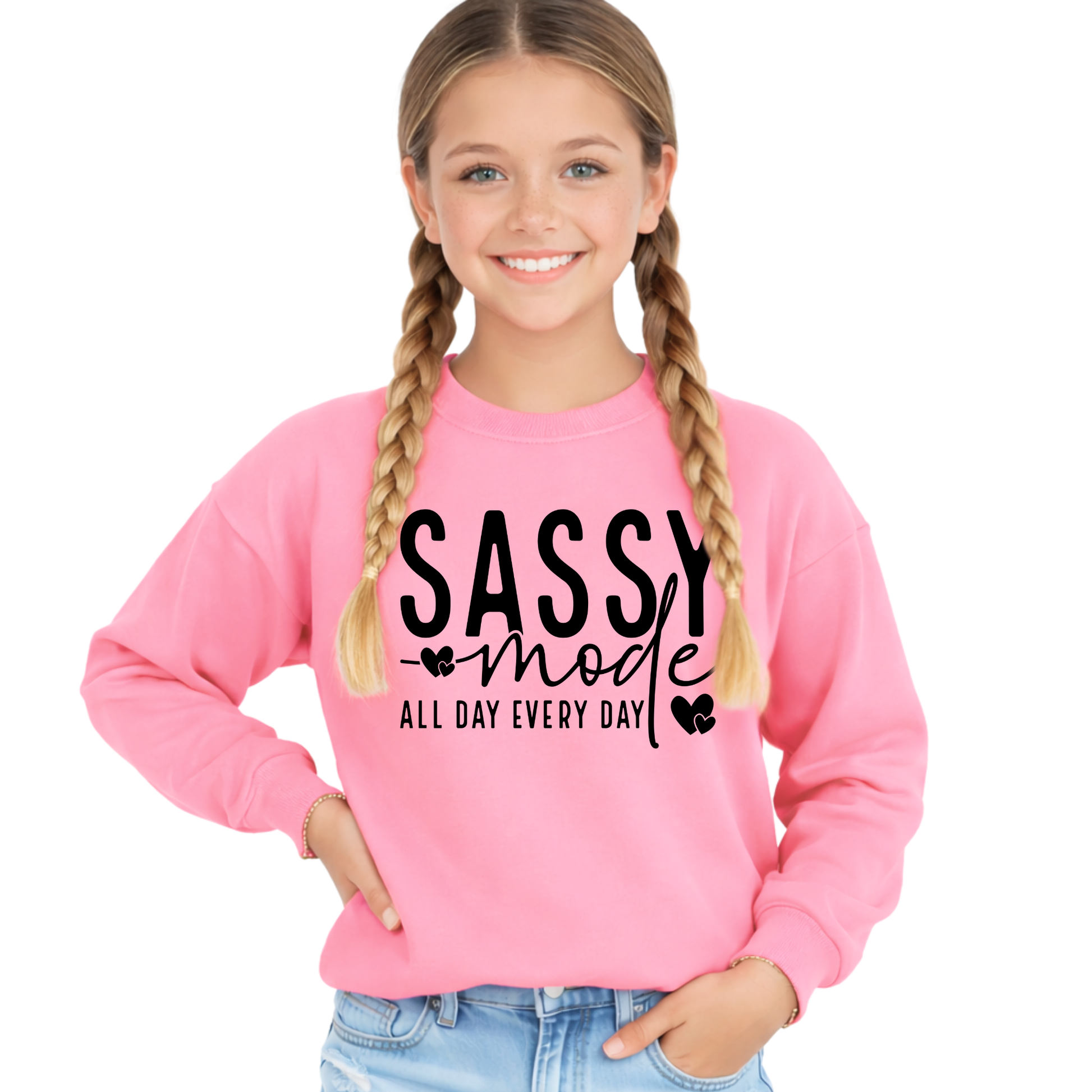 Young girl wearing a pink sweatshirt with 'Sassy Mode All Day Every Day' text on a white background