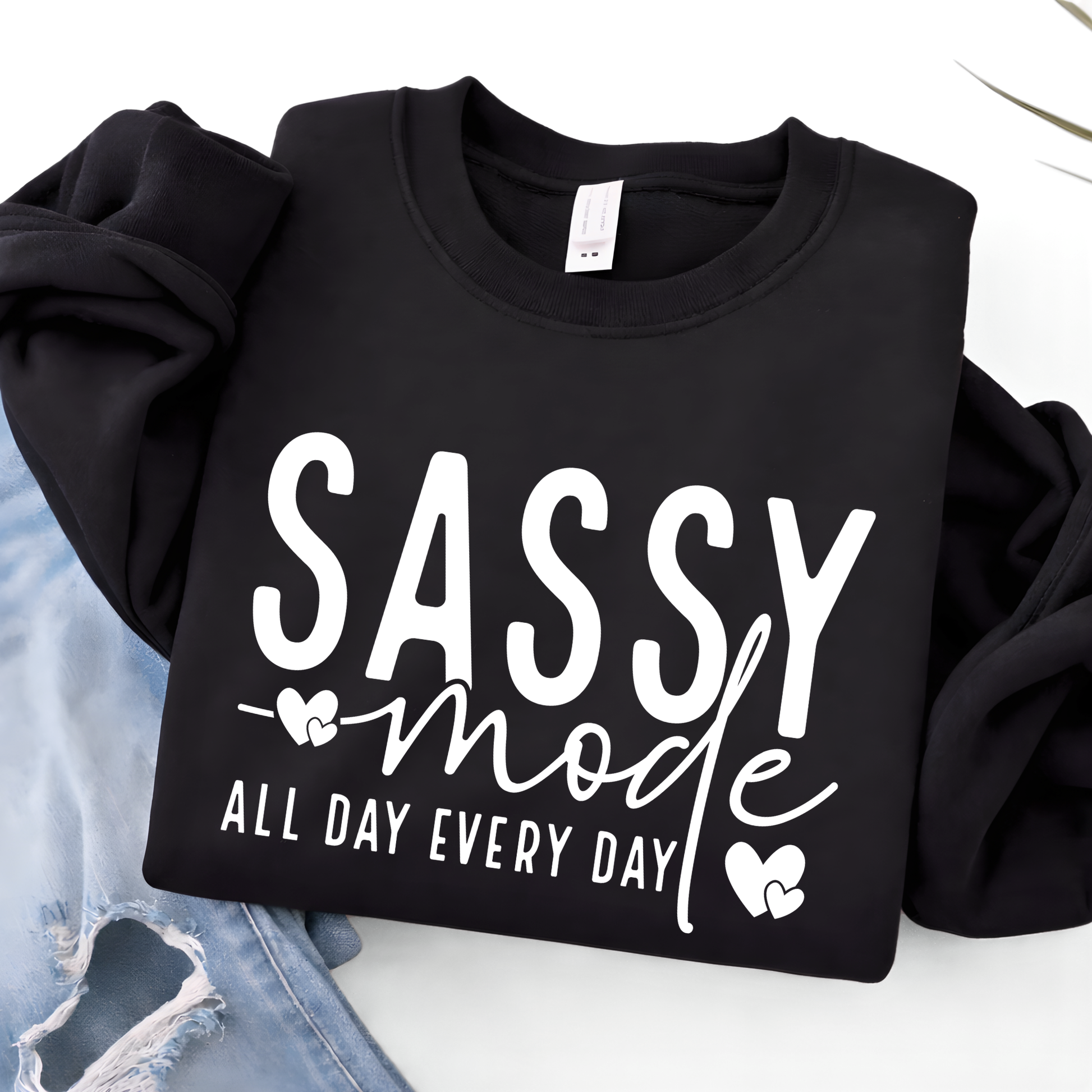 Black sweatshirt with 'Sassy mode all day every day' text on a white background