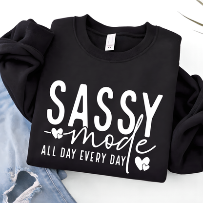 Black sweatshirt with 'Sassy mode all day every day' text on a white background
