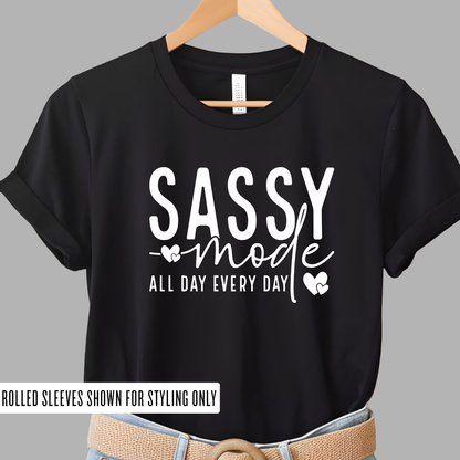 Black t-shirt with 'Sassy mode all day every day' text on a gray background