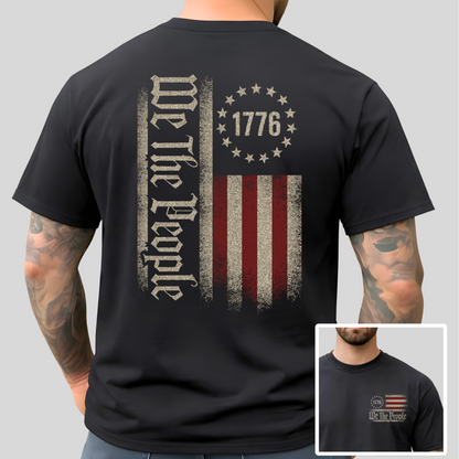 Black t-shirt with 'We The People' and American flag design on a gray background