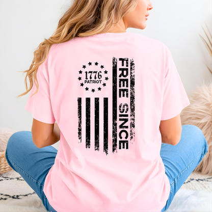 Person wearing a pink t-shirt with a black graphic design on the back.