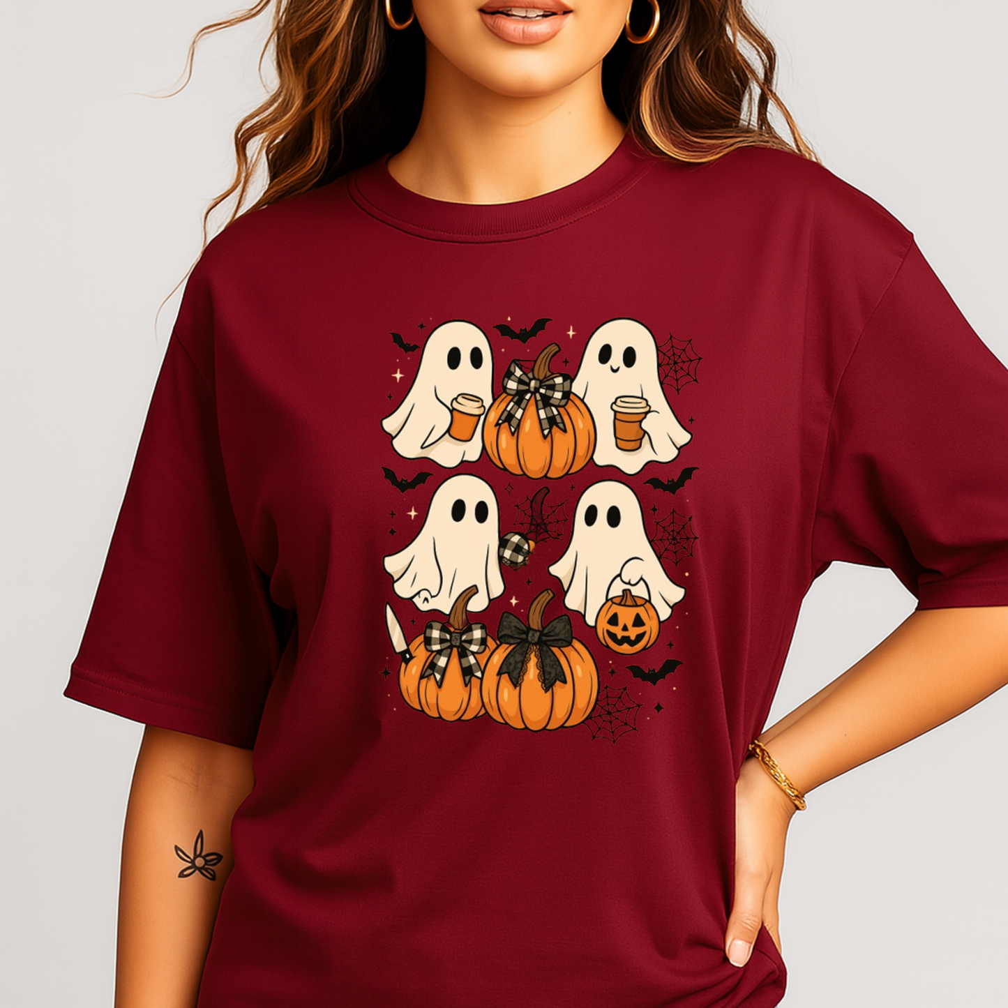 "Deep burgundy Halloween T-shirt featuring cute ghosts holding coffee and pumpkins with bows. Perfect cozy fall tee for women’s autumn fashion and Halloween parties.