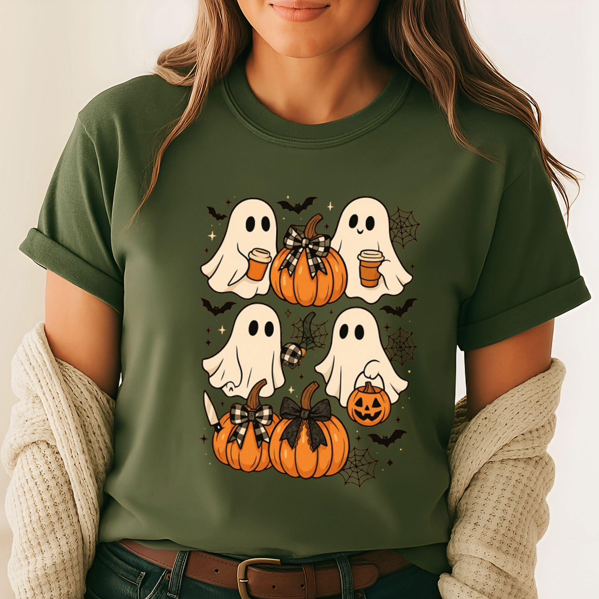 green Halloween T-shirt with ghost and pumpkin graphics. Perfect autumn tee for spooky season, layered with cardigans or flannels for casual fall outfits.