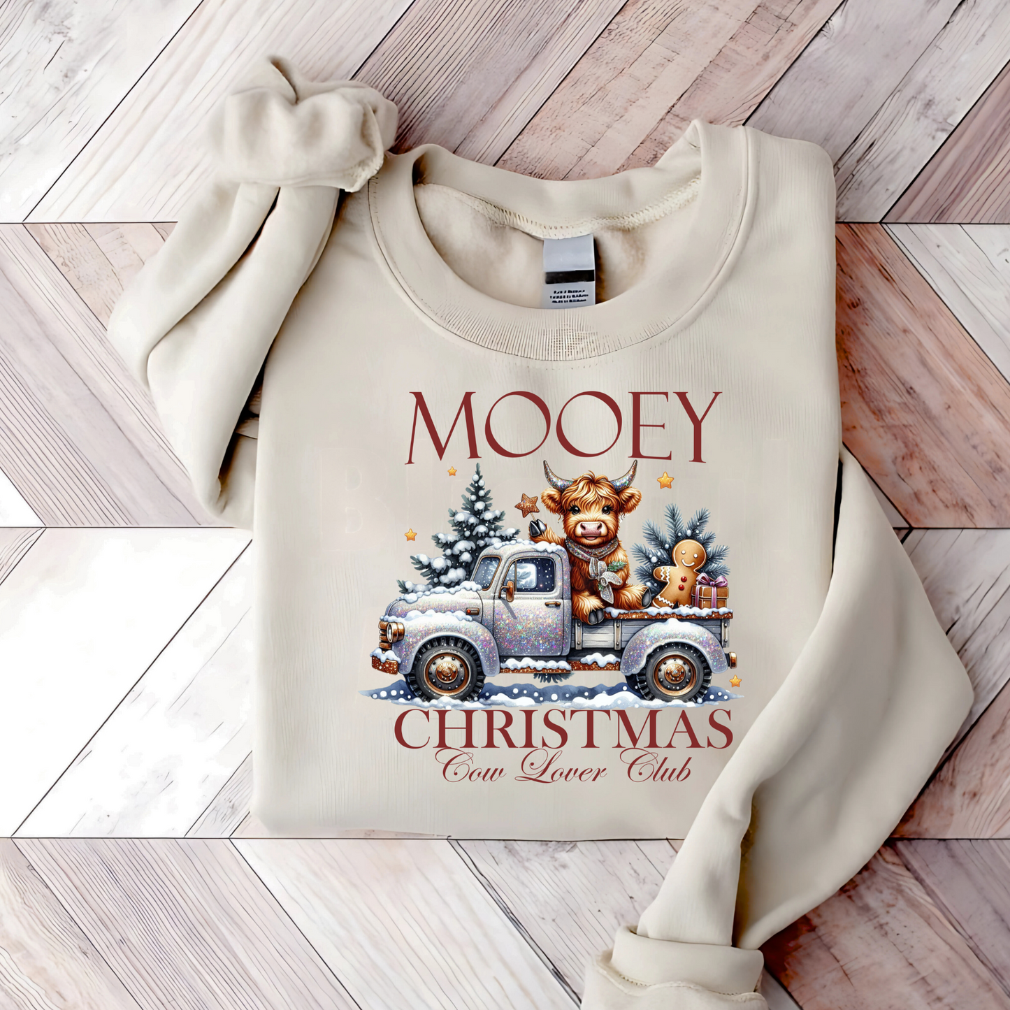 Light Sand sweatshirt with “Mooey Christmas Cow Lover Club” graphic
