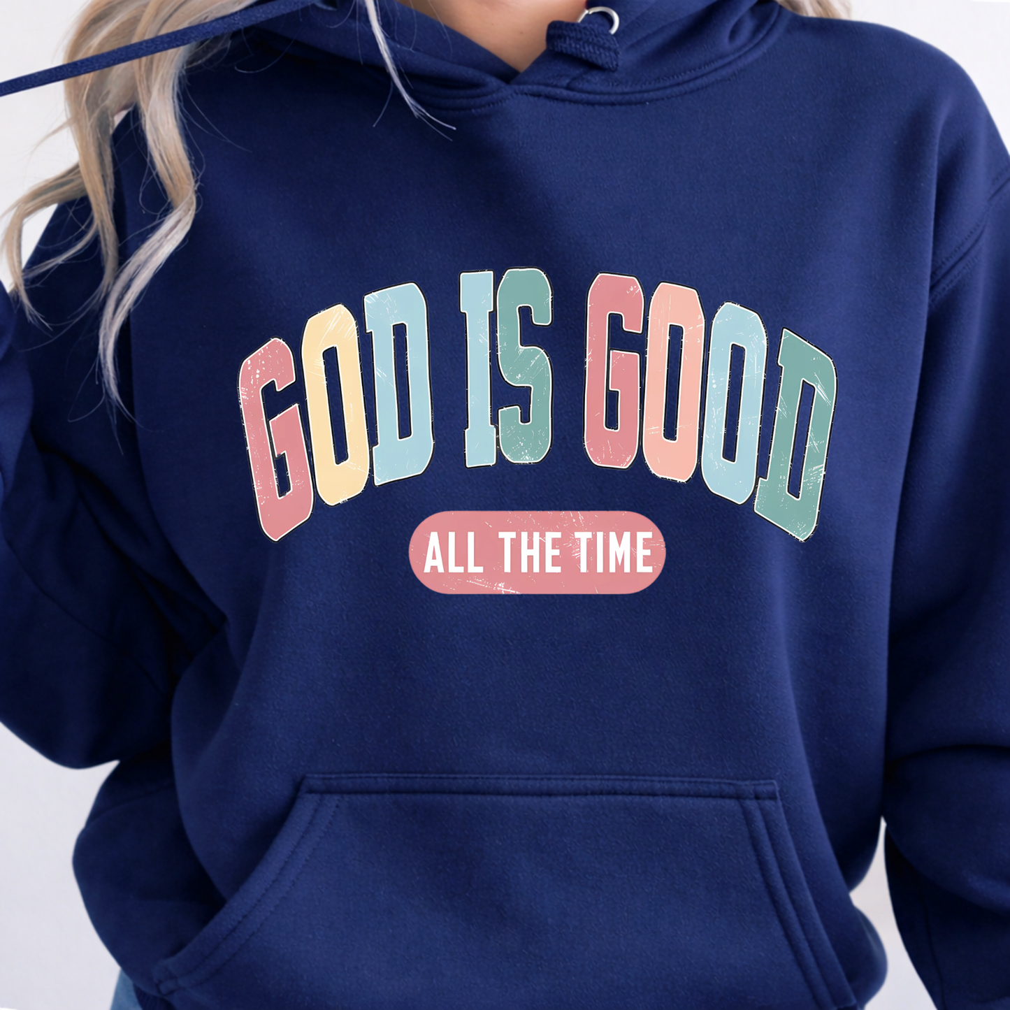 Navy blue hoodie with 'GOD IS GOOD ALL THE TIME' text in colorful letters on a plain background