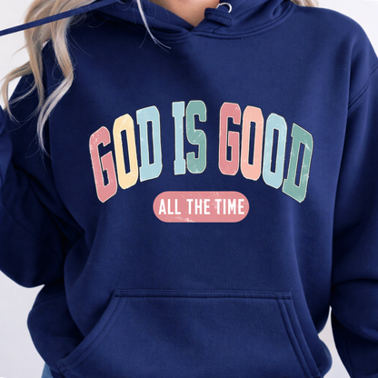 Navy blue hoodie with 'GOD IS GOOD ALL THE TIME' text in colorful letters on a plain background