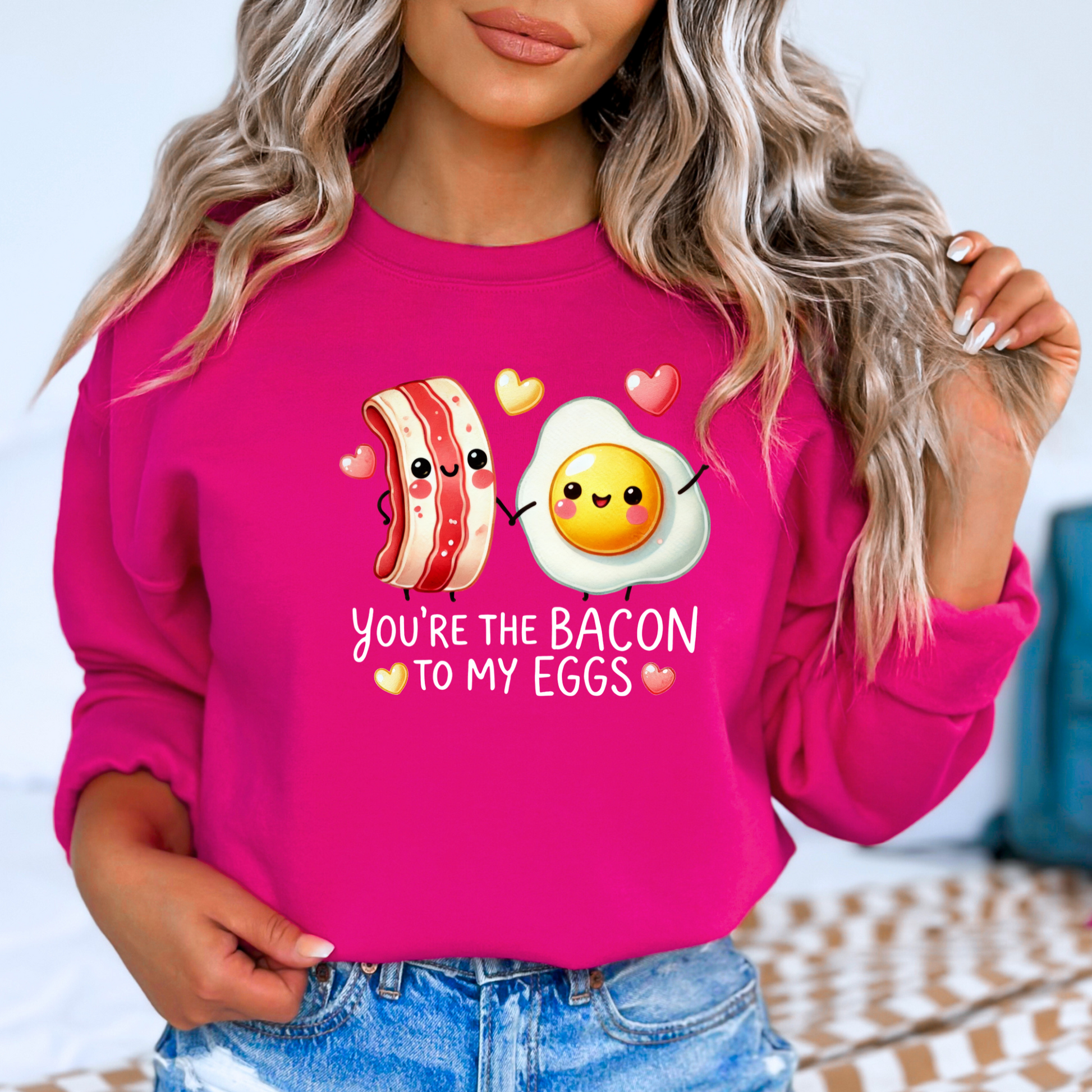 Dark pink sweatshirt featuring bacon and egg couple with hearts

