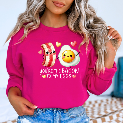Dark pink sweatshirt featuring bacon and egg couple with hearts

