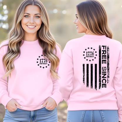 Woman wearing a pink sweatshirt with '1776 Patriot' text on the front and 'Free Since' on the back.