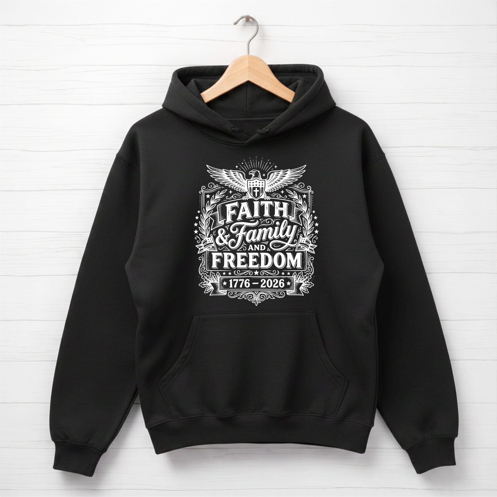 Black hoodie with 'Faith & Family Freedom' text on a white background