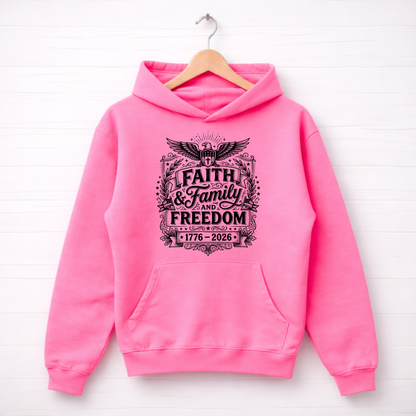 Pink hoodie with 'Faith & Family Freedom' text on a white background