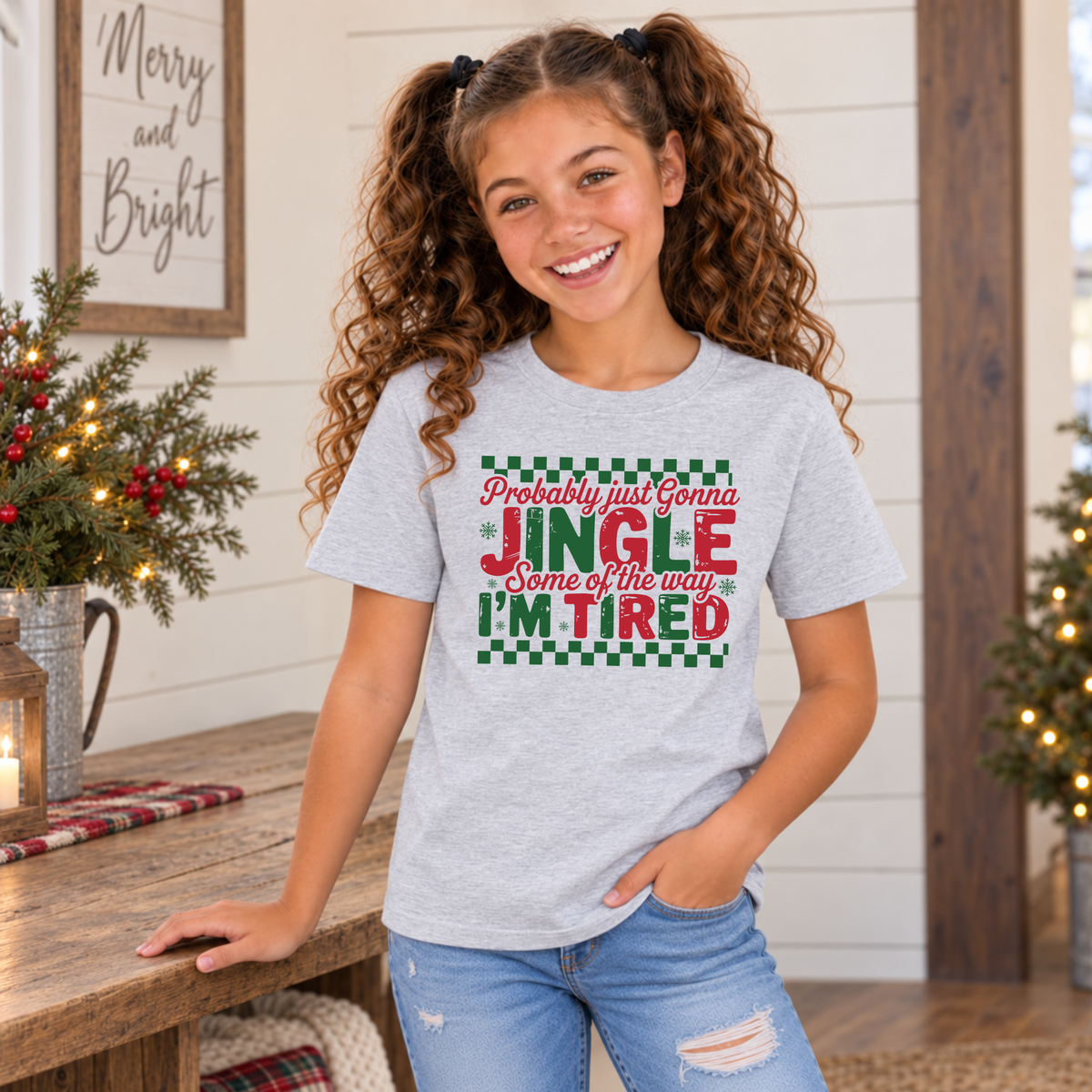 Girl wearing a sport gray youth T-shirt with red and green Probably Just Gonna Jingle Some of the Way I'm Tired Christmas design