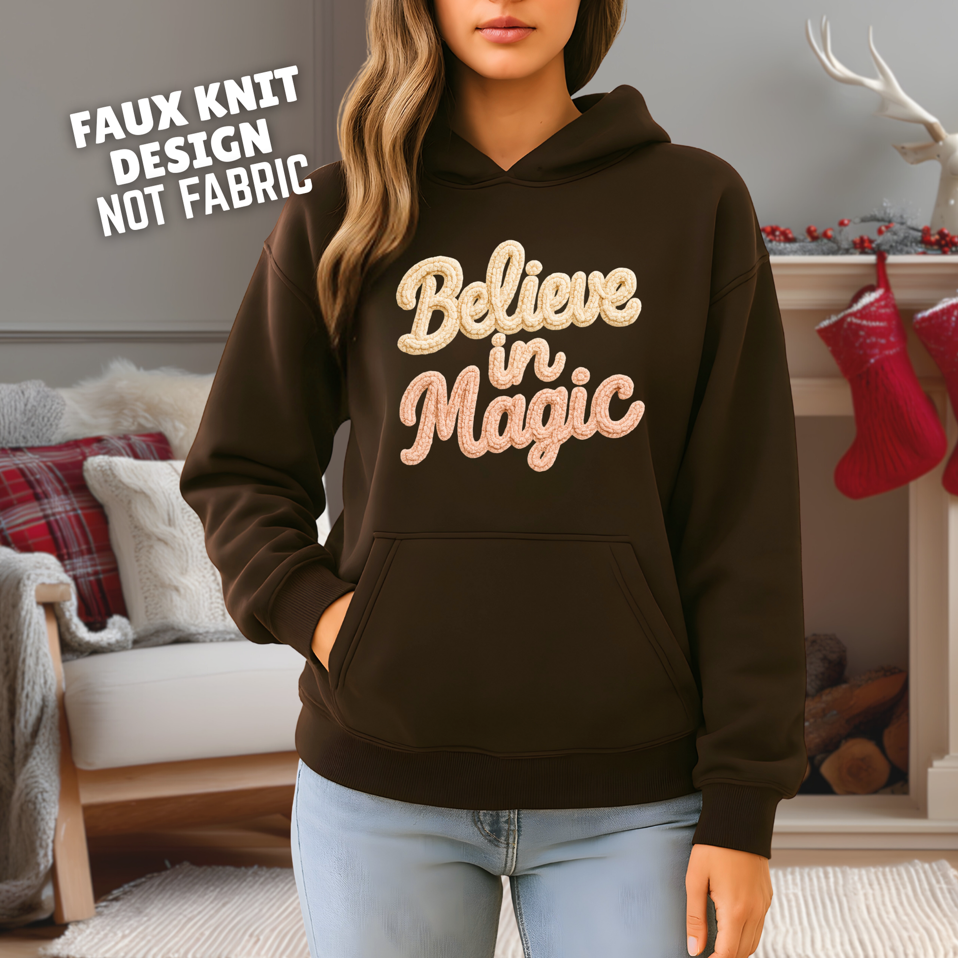 Person wearing a brown hoodie with 'Believe in Magic' text in a cozy room.