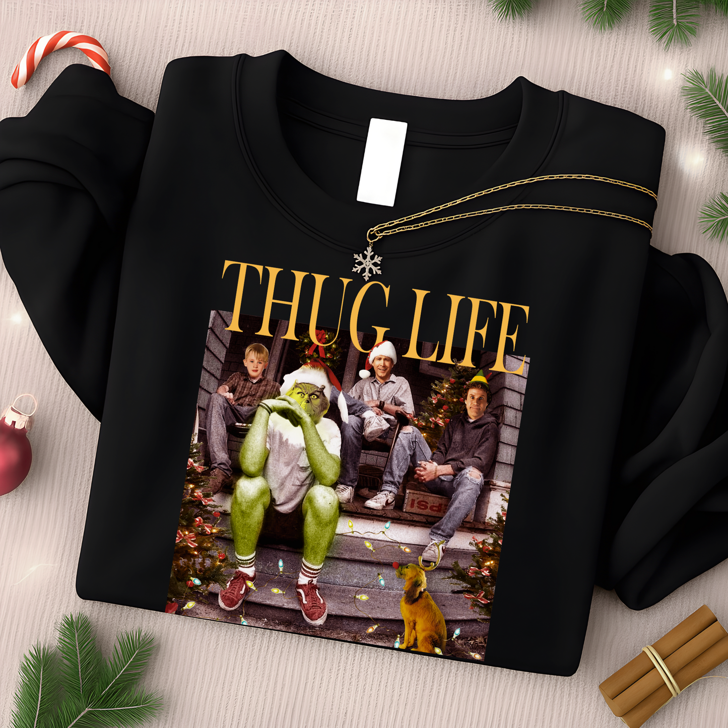 Black sweatshirt with 'Thug Life' graphic featuring characters on a festive background