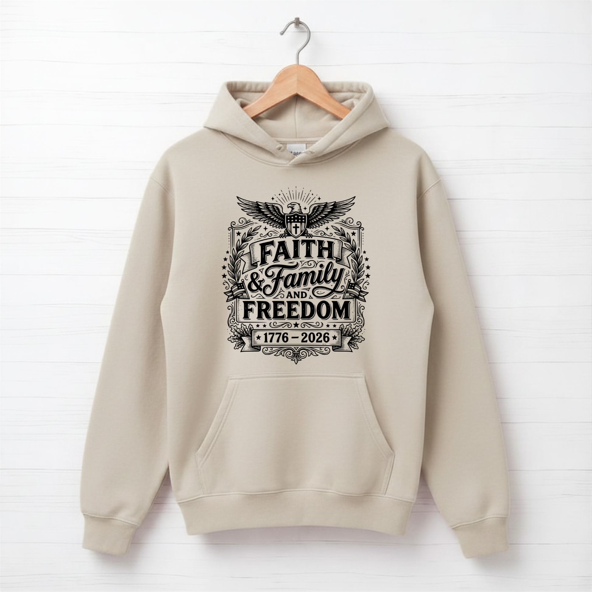 Beige hoodie with 'Faith & Family Freedom' text on a white background