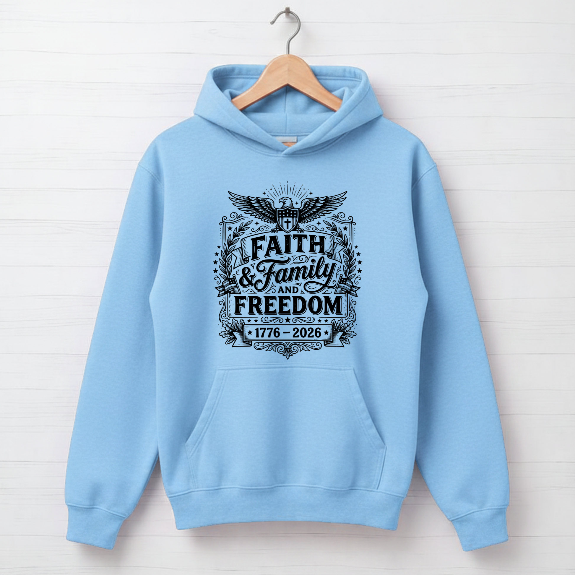 light blue hoodie with 'Faith & Family Freedom' text on a white background