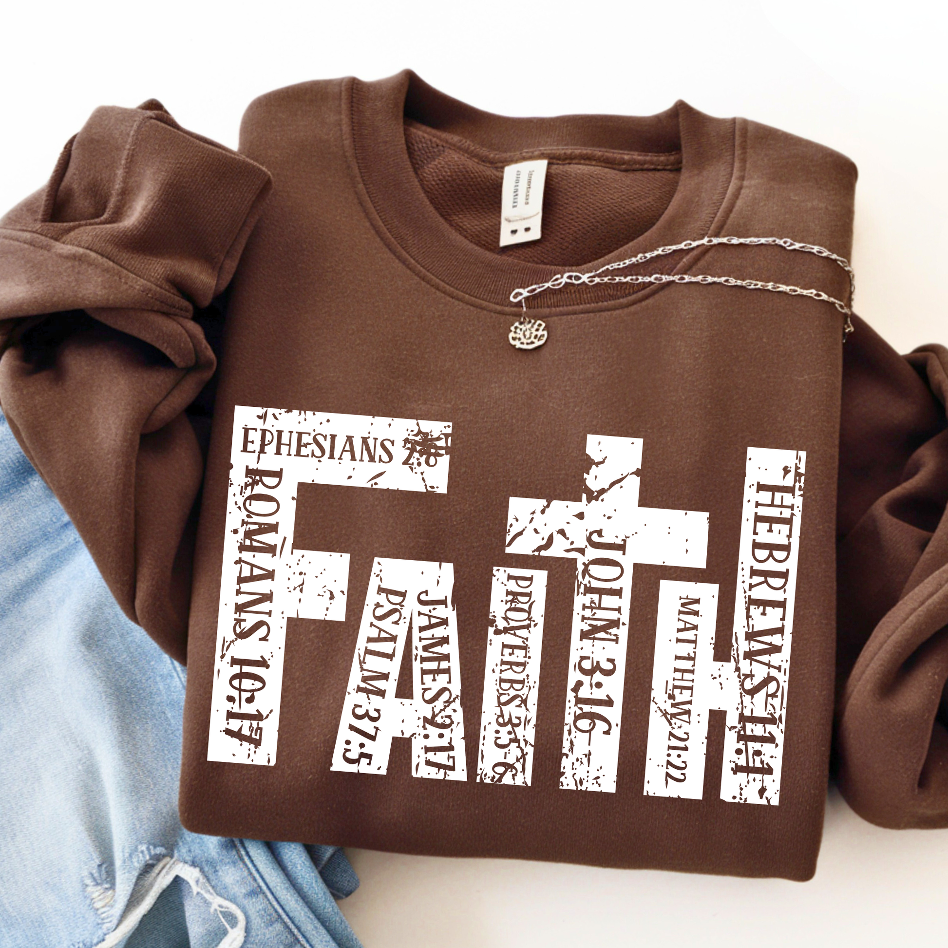 Brown sweatshirt with white text design on a white background