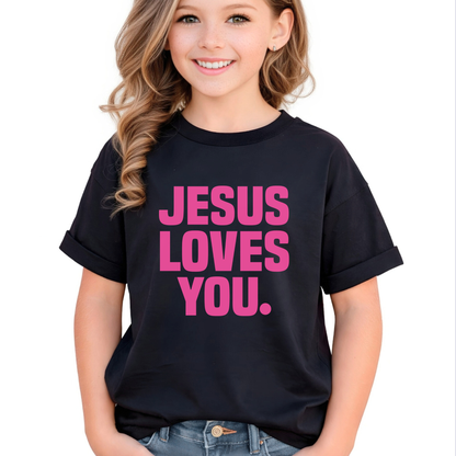 Child wearing a black t-shirt with 'Jesus Loves You' in pink text on a white background