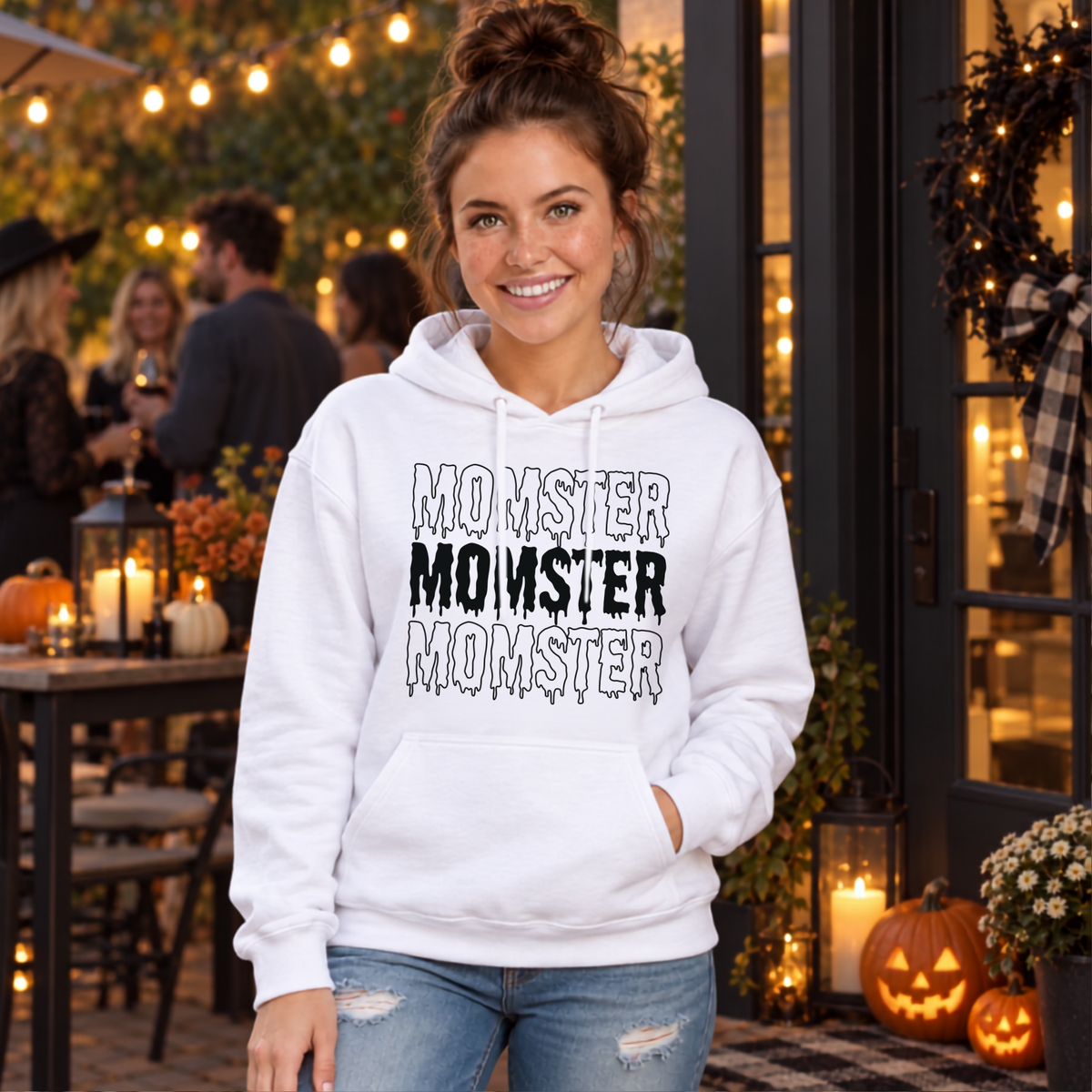 Woman wearing the MOMSTER Halloween design in a seasonal lifestyle setting.