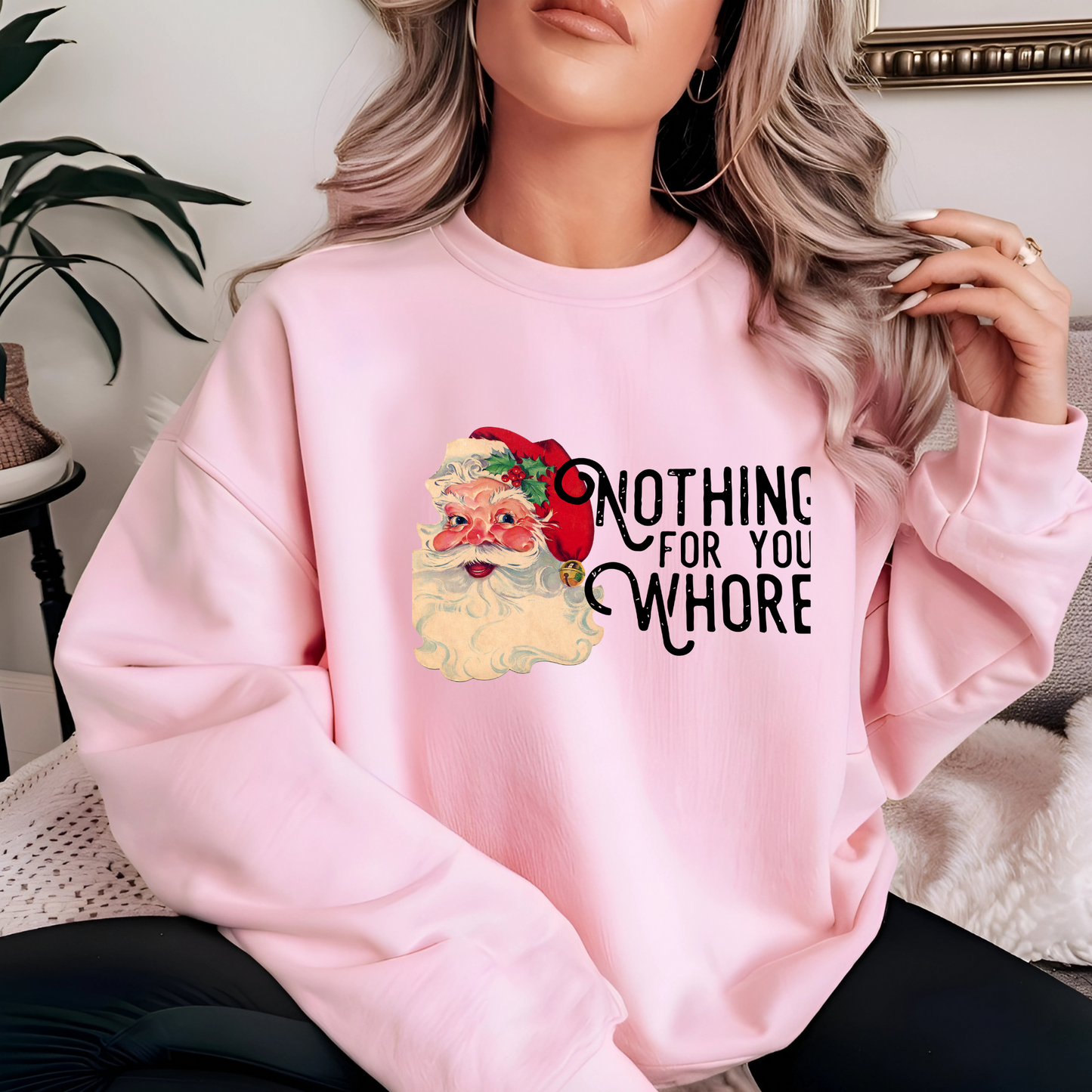 Light Pink Sweatshirt Worn by Woman – Woman in light pink sweatshirt with vintage Santa and bold holiday humor message