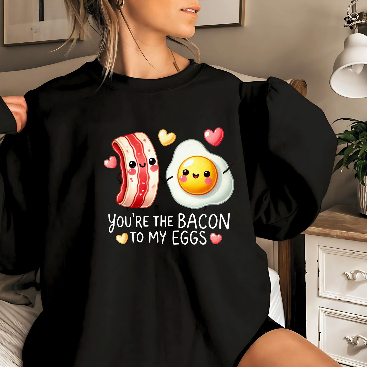 Black sweatshirt with kawaii bacon and egg and heart graphics
