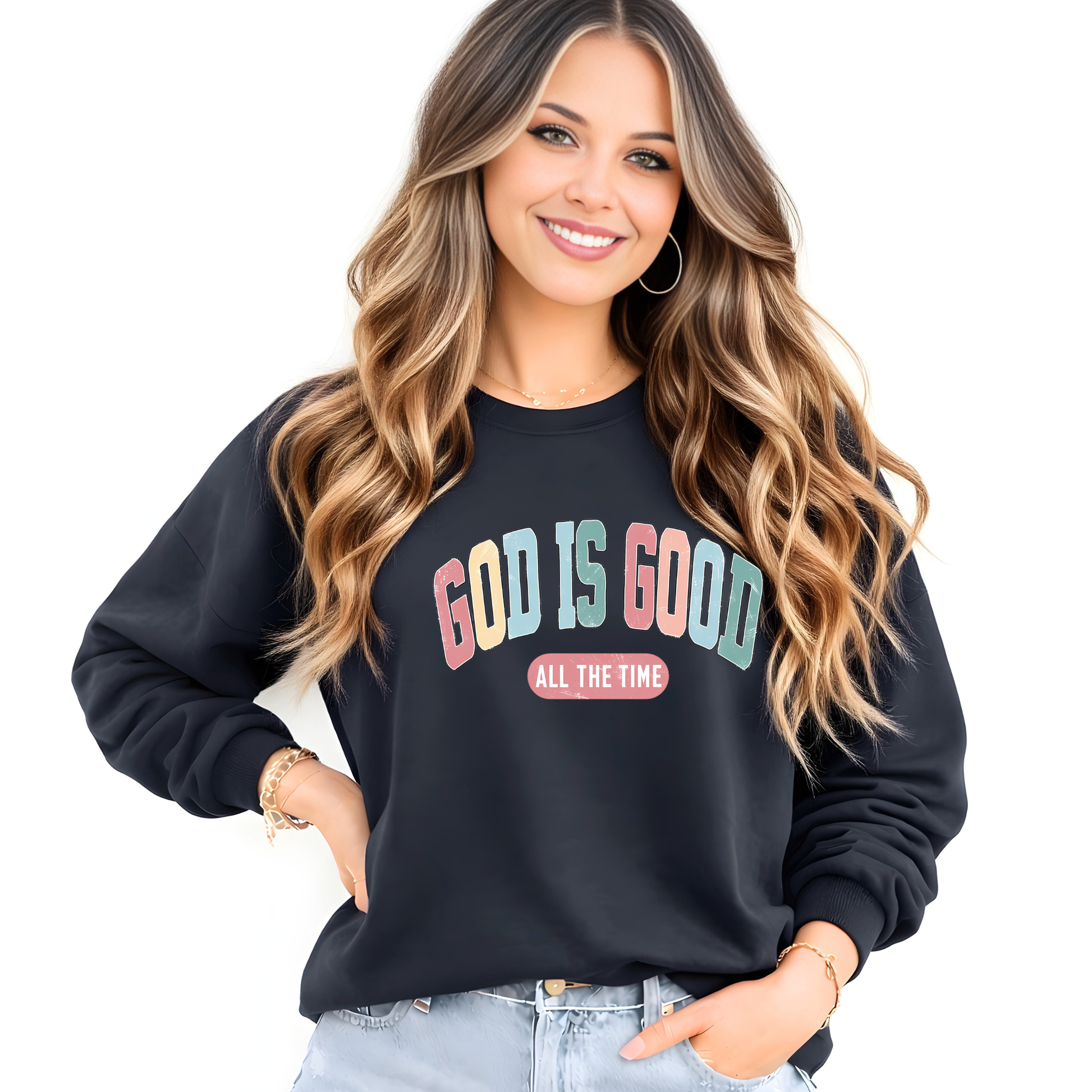 Woman wearing a black sweatshirt with 'God is Good All the Time' text on a white background