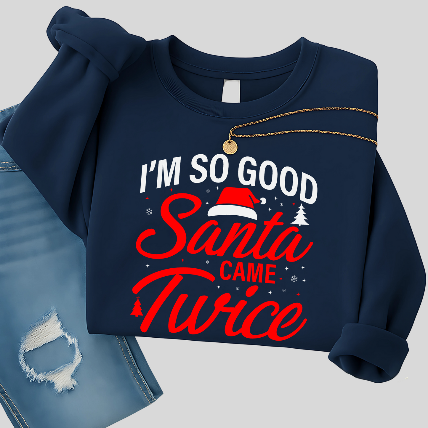 Woman in navy Christmas pullover holding a coffee mug
