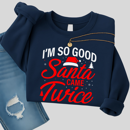Woman in navy Christmas pullover holding a coffee mug
